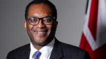 Kwasi Kwarteng UK's Chancellor of the Exchequer stands in front of a Union Jack flag