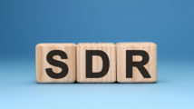 SDR - text concept on wooden cubes with gradient blue background